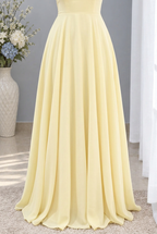 Vestido largo amarillo suave escote V con flor al hombro cod. VC024